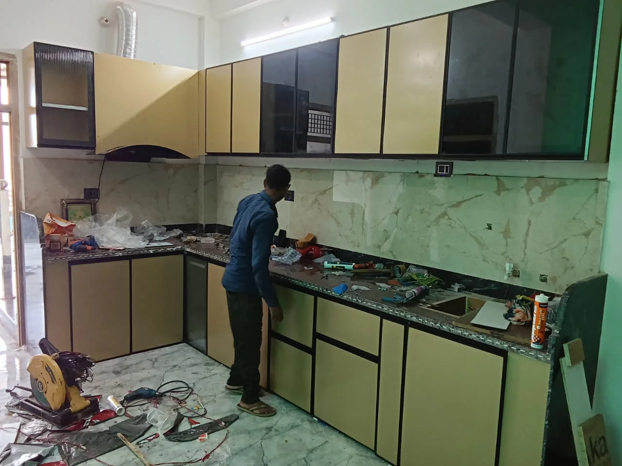 Modern L-Shaped Acrylic Modular Kitchen & Pantry executed by Sparsh Trading